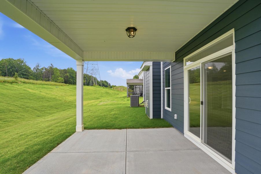 Exterior details and patio area of a home in Enclave at Riverdale, Huntersville (Image 19).