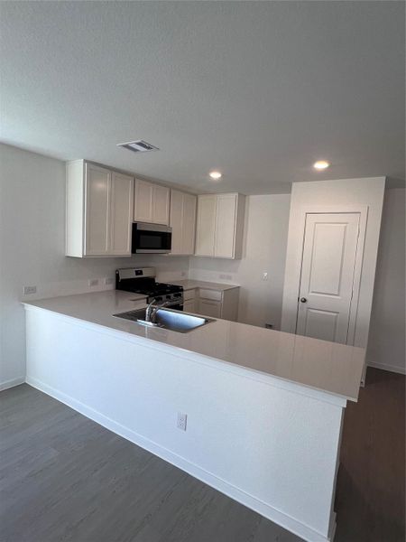 Well-designed kitchen boasting tons of storage and a beautiful island!