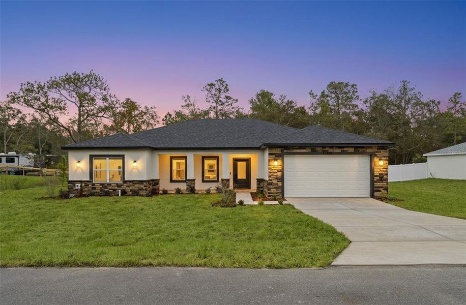 Front exterior of a new home in , Weeki Wachee, FL, highlighting curb appeal (Image 25). Front exterior of a new home in , Weeki Wachee, FL, highlighting curb appeal (Image 25).