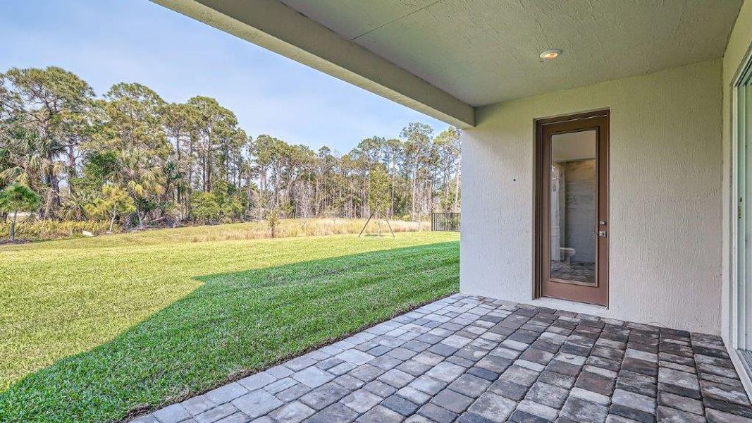 Representative exterior photo of a completed home built from the Ponte Vedra by D.R. Horton in Preserves at Park Trace, Stuart, FL (Image 18).