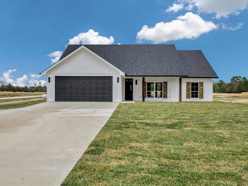 Front exterior of a new home in , Huntington, TX, highlighting curb appeal (Image 22).