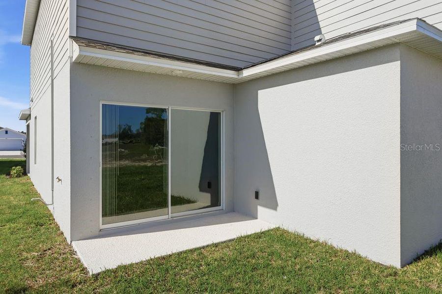 Exterior details and patio area of a home in Palm Wind, Hudson (Image 3).