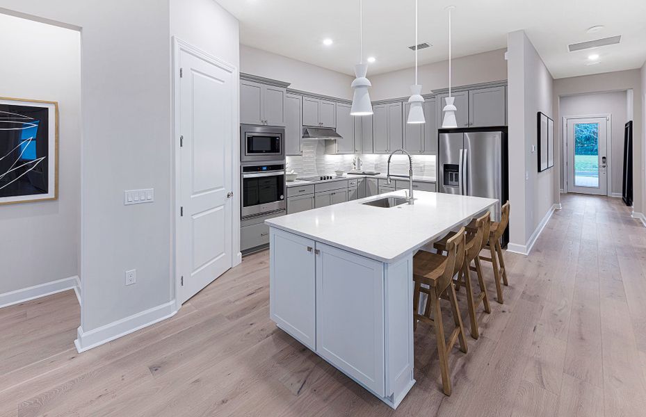 Representative furnished interior of a home built from the Mystique by DiVosta in Emerson Oaks, Vero Beach (Image 13).