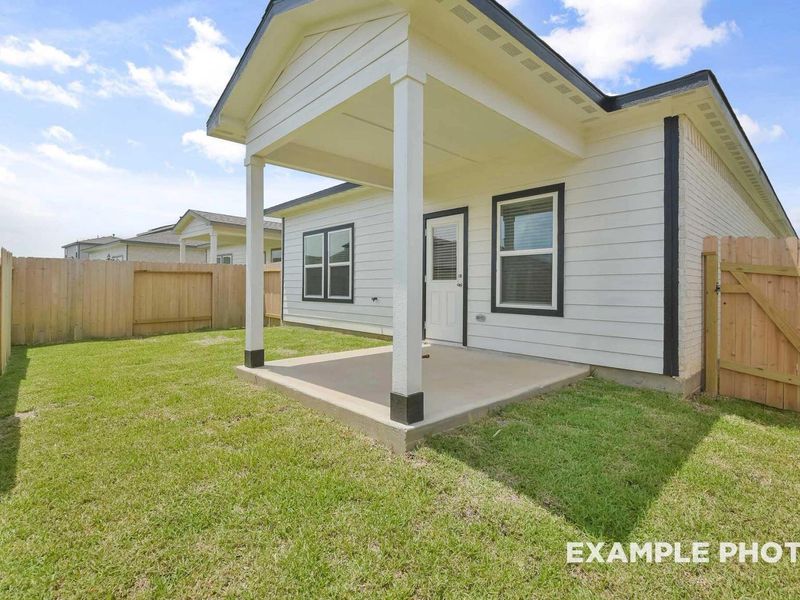Exterior details and patio area of a home in Caney Creek Place, Conroe (Image 3).