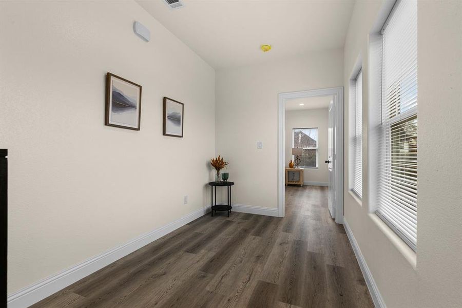 Hallway with dark wood-type flooring