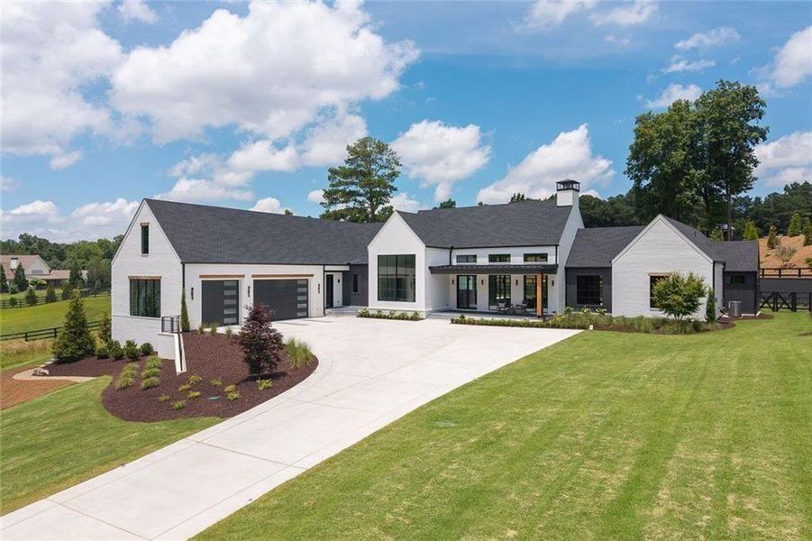 Front exterior of a new home in , Canton, GA, highlighting curb appeal (Image 26).