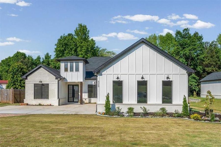 Front exterior of a new home in , Lilburn, GA, highlighting curb appeal (Image 1). Front exterior of a new home in , Lilburn, GA, highlighting curb appeal (Image 1).