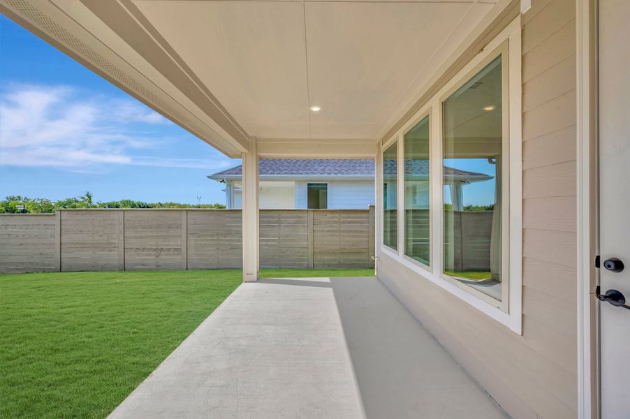 Exterior details and patio area of a home in Treeline, Justin (Image 3).