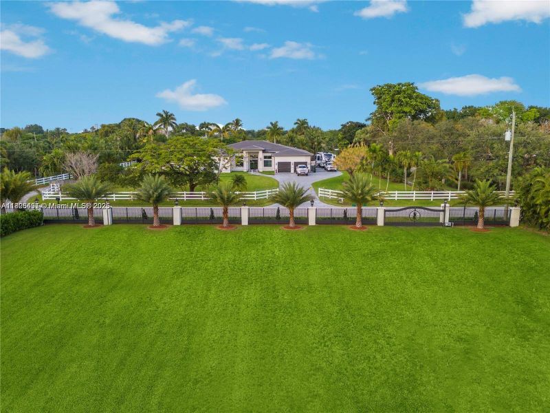 Front exterior of a new home in , Southwest Ranches, FL, highlighting curb appeal (Image 2).