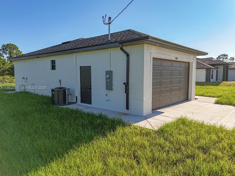 SIDE DOOR LEADING INTO GARAGE