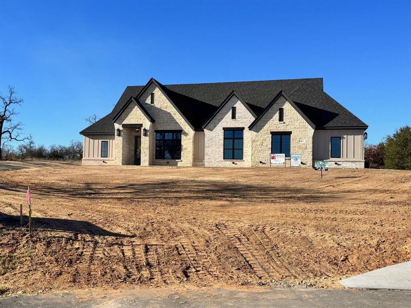 Front exterior of a new home in , Azle, TX, highlighting curb appeal (Image 1). Front exterior of a new home in , Azle, TX, highlighting curb appeal (Image 1).