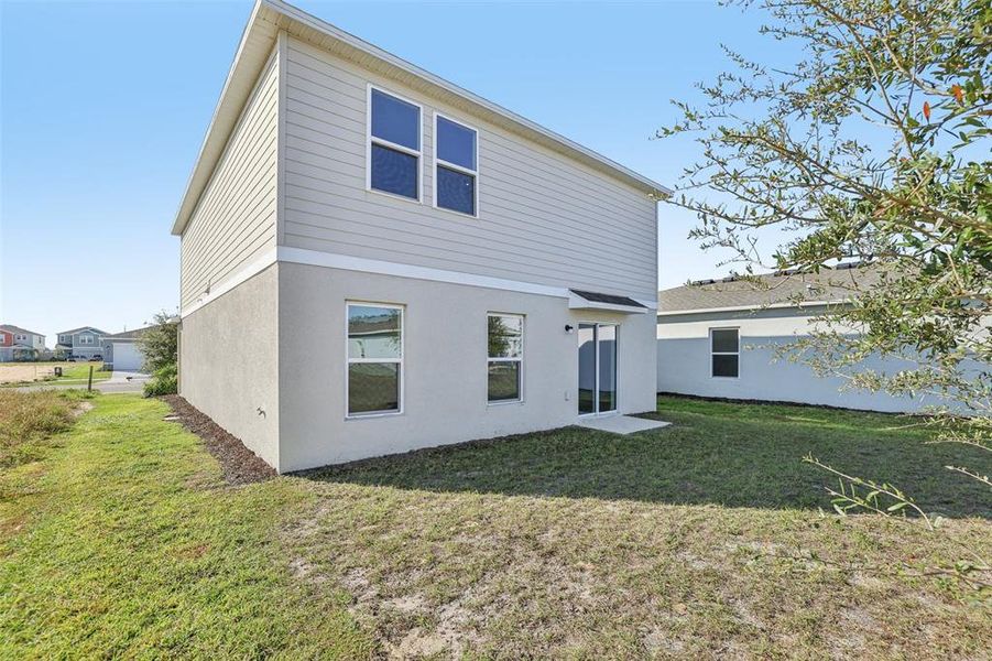 Exterior details and patio area of a home in The Reserve at Bradbury Creek, Haines City (Image 8).