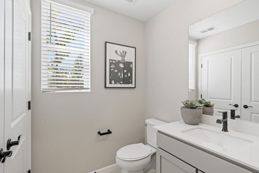 Representative furnished interior of a home built from the 2403 by Risewell Homes in Harvest Crossing, Aurora (Image 18).