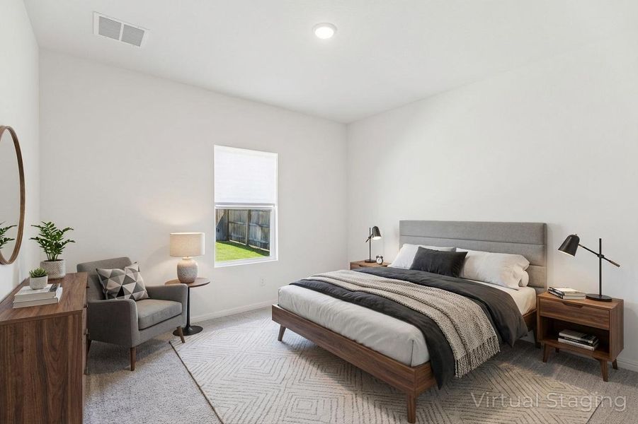 Bedroom featuring light colored carpet and baseboards