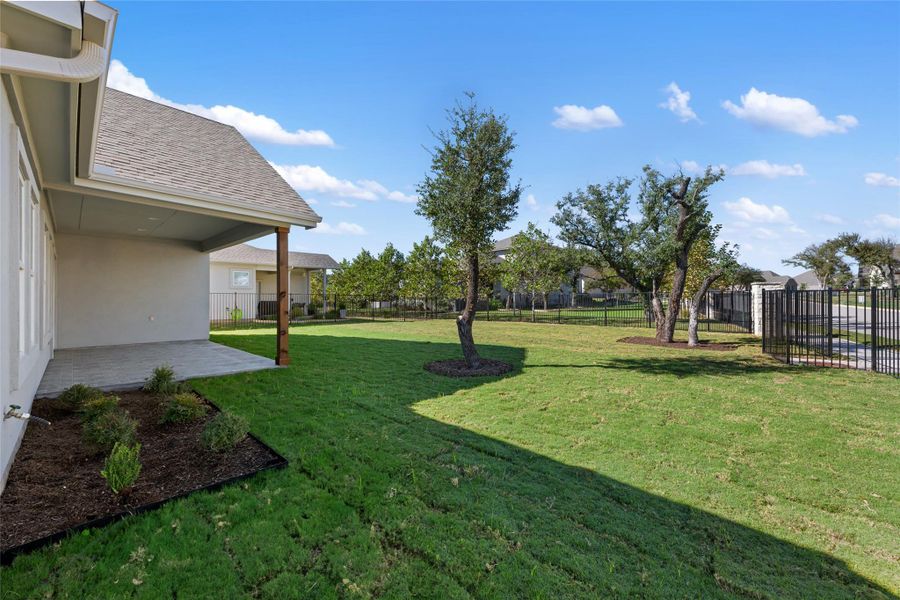 Fenced backyard featuring a patio area