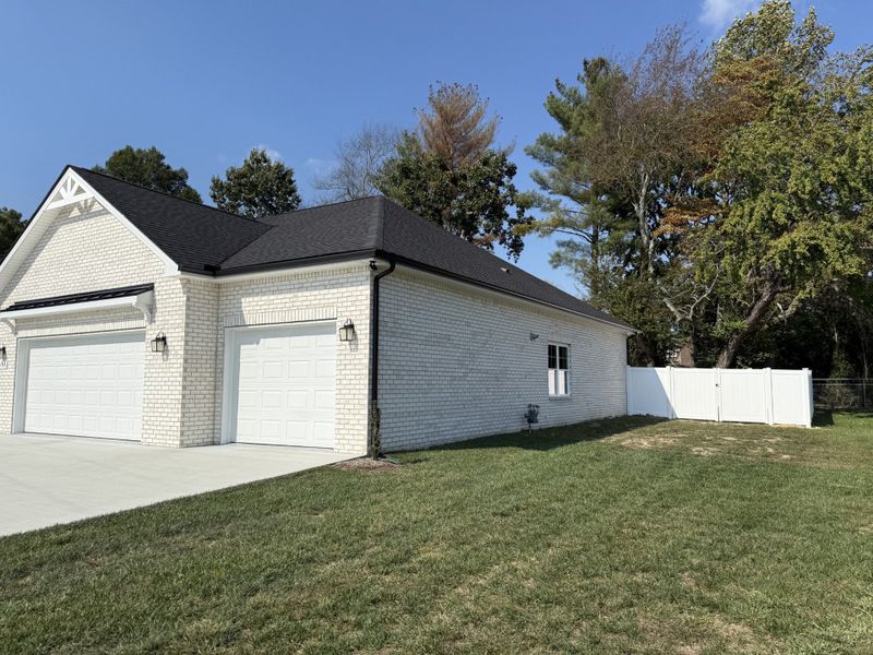 Front exterior of a new home in Fox Run, Manchester, TN, highlighting curb appeal (Image 21).