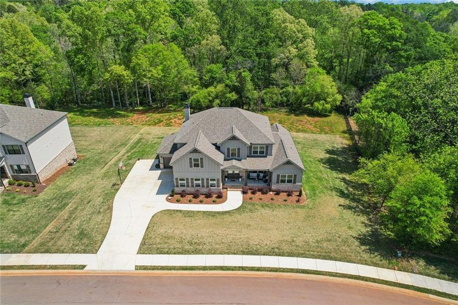 Front exterior of a new home in , Hoschton, GA, highlighting curb appeal (Image 30).
