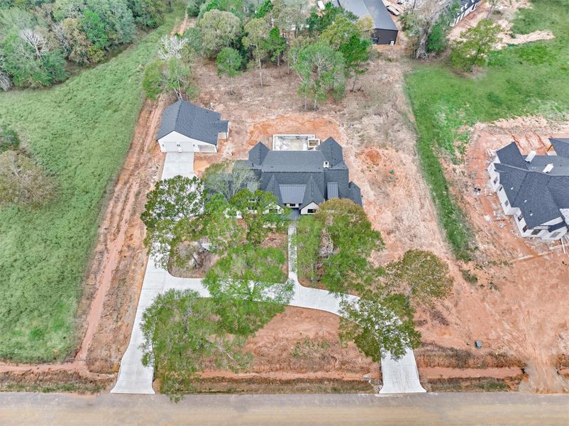 A stunning 1.5-acre estate featuring a beautifully designed custom home, detached casita, long private drive, and expansive grounds—complete with a pool site, outdoor kitchen and mature trees that enhance the privacy and natural beauty of the property.”