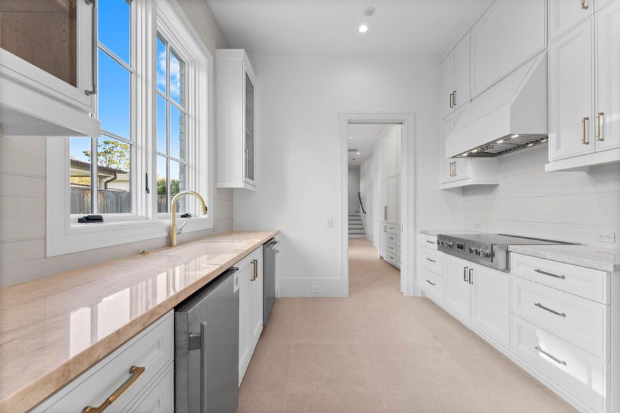 The catering kitchen includes gold hardware, ice maker and dishwasher The catering kitchen includes gold hardware, ice maker and dishwasher