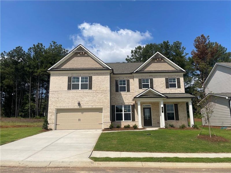 Front exterior of a new home in Summerlin, Winder, GA, highlighting curb appeal (Image 23).