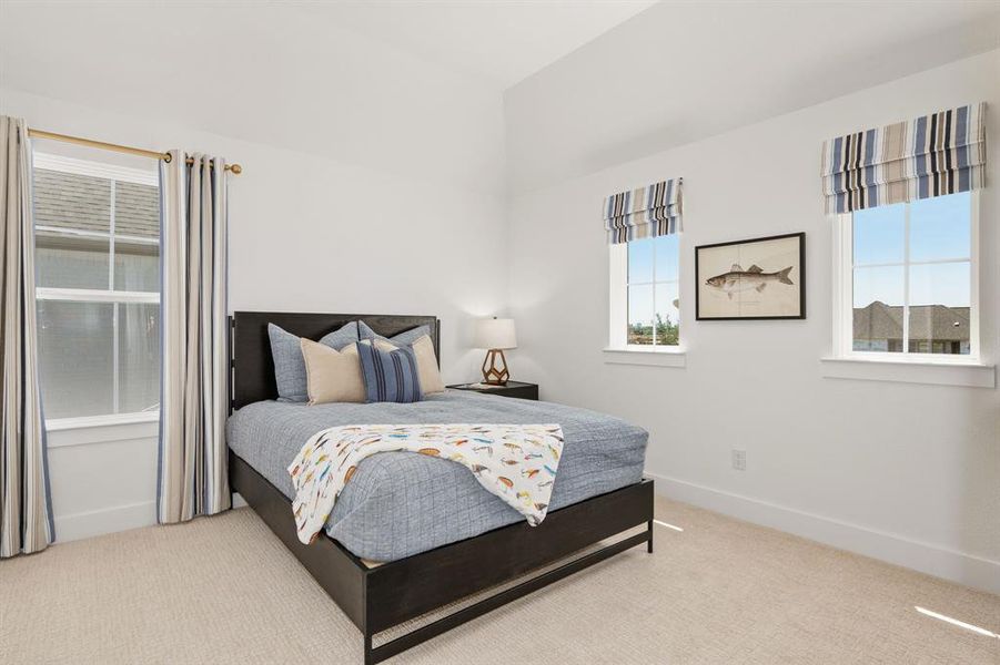 Bedroom with carpet floors and baseboards Bedroom with carpet floors and baseboards