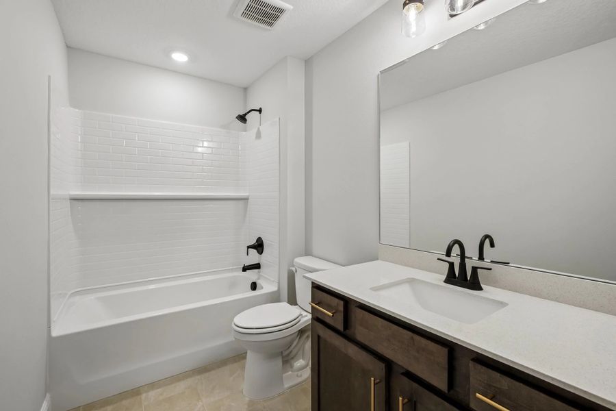 Bathroom 3 located off the hallway features aspects of AW Collection® Oxford