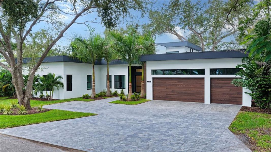Front exterior of a new home in , Sarasota, FL, highlighting curb appeal (Image 2). Front exterior of a new home in , Sarasota, FL, highlighting curb appeal (Image 2).