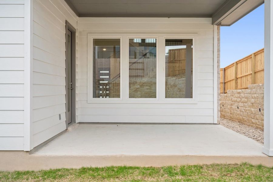 Exterior details and patio area of a home in Park Collection at Lariat, Liberty Hill (Image 4).