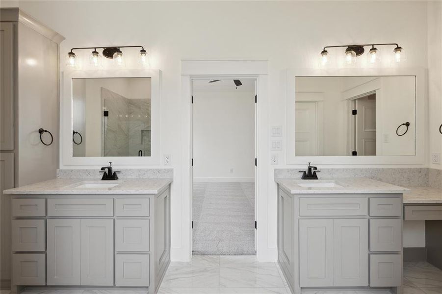 Bathroom with vanity and a shower with shower door