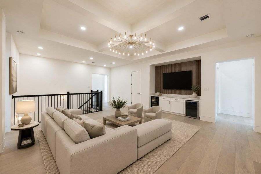 Game room featuring elegant coffered ceilings, a built-in wine fridge, mini fridge, and a spacious layout ideal for entertaining and relaxed living. **virtually staged**