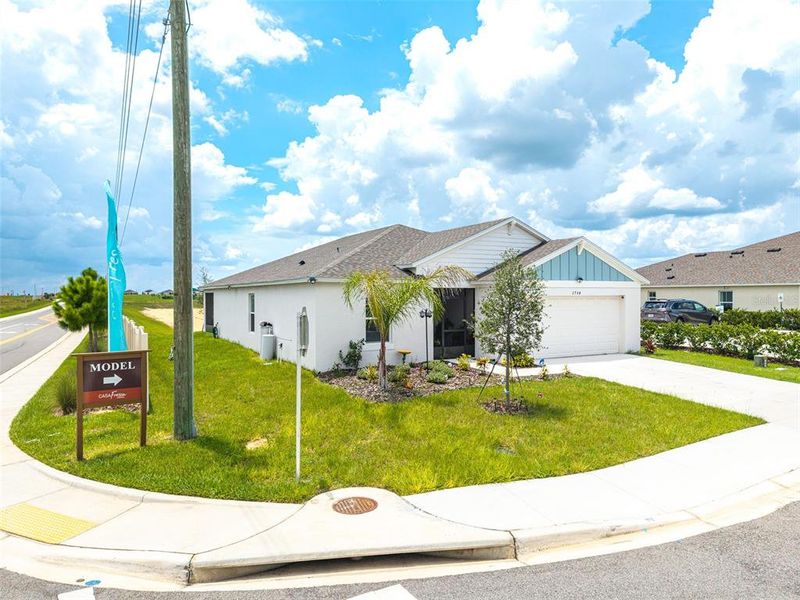 Front exterior of a new home in , Haines City, FL, highlighting curb appeal (Image 17).
