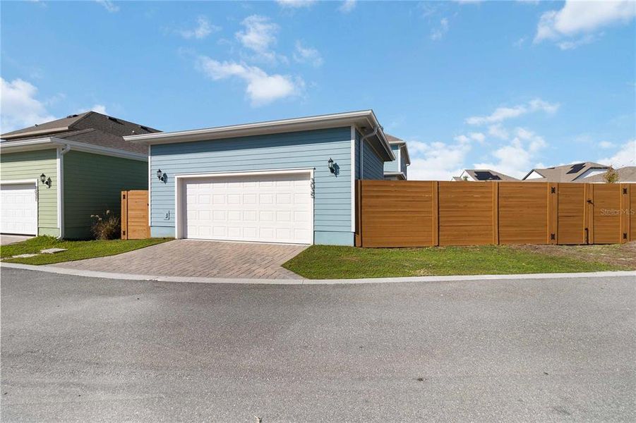 Front exterior of a new home in Weslyn Park at Sunbridge (Craft Homes), St. Cloud, FL, highlighting curb appeal (Image 22).