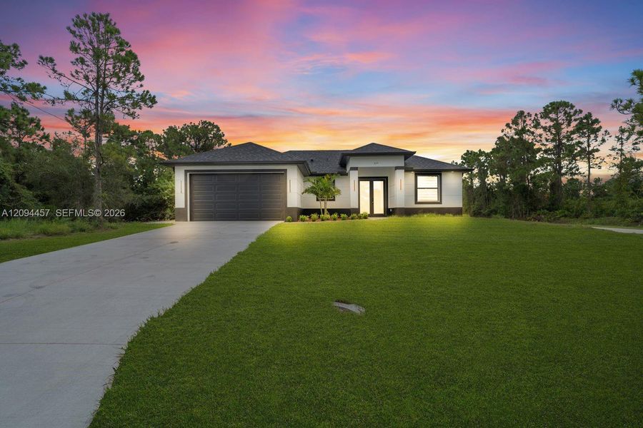 Front exterior of a new home in , Lehigh Acres, FL, highlighting curb appeal (Image 21). Front exterior of a new home in , Lehigh Acres, FL, highlighting curb appeal (Image 21).