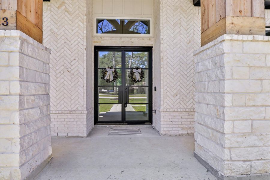 Welcoming Front Porch with Large Glass Doors