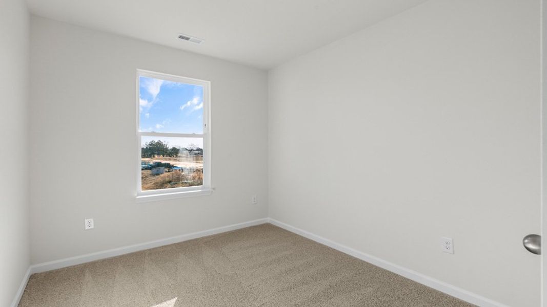 Spacious, unfurnished interior of a new home in The Townes at Honeycutt Oaks, Angier (Image 19).