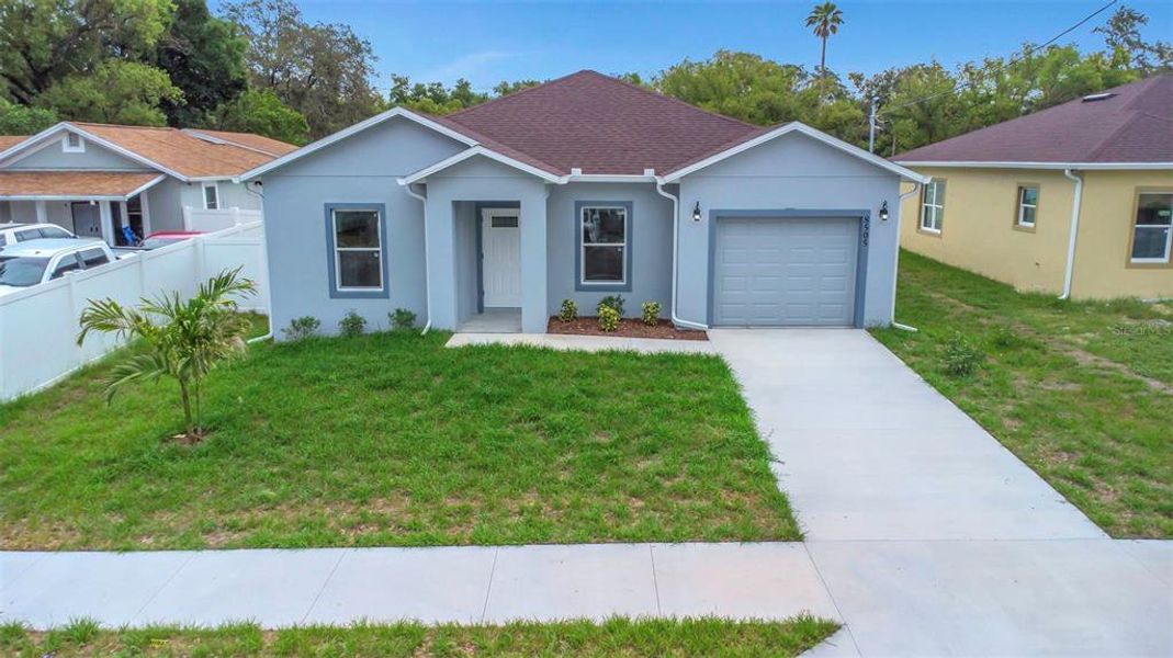 Front exterior of a new home in , Tampa, FL, highlighting curb appeal (Image 29).