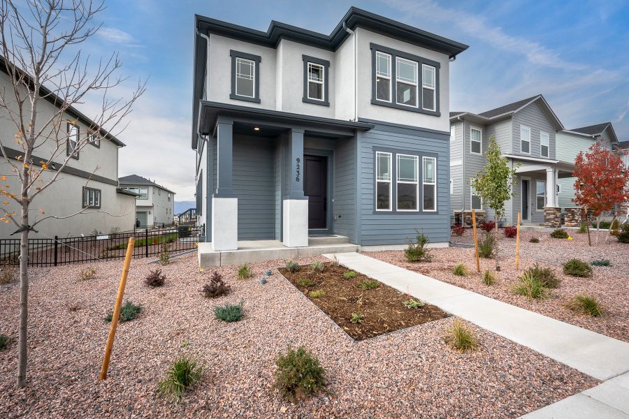Front exterior of a new home in Revel Crossing at Wolf Ranch – The Outlook Collection, Colorado Springs, CO, highlighting curb appeal (Image 26). Front exterior of a new home in Revel Crossing at Wolf Ranch – The Outlook Collection, Colorado Springs, CO, highlighting curb appeal (Image 26).
