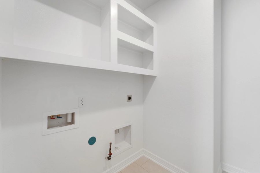 Utility room. Note: Sample product photo. Actual exterior and interior selections may vary by homesite. Photo may be virtually staged