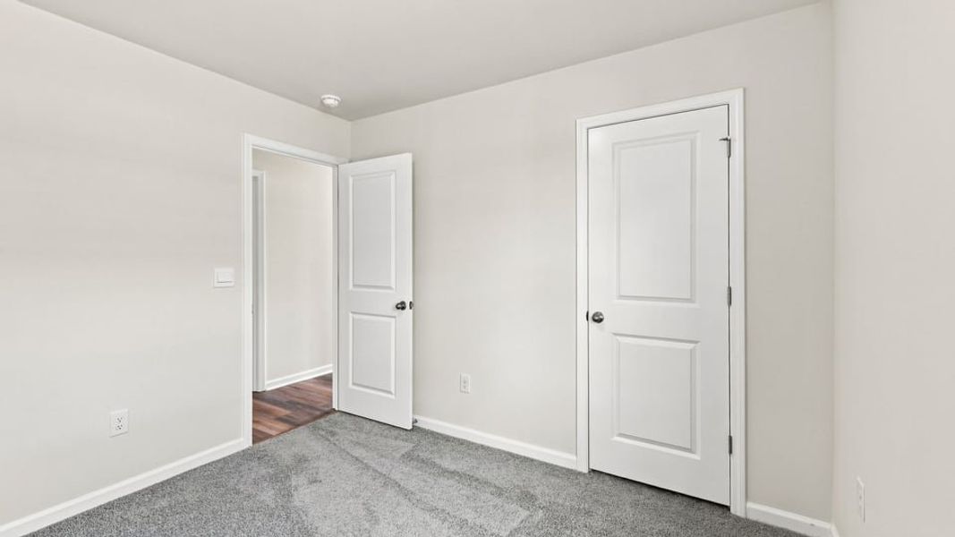 Spacious, unfurnished interior of a new home in Village 3, Woodruff (Image 23).