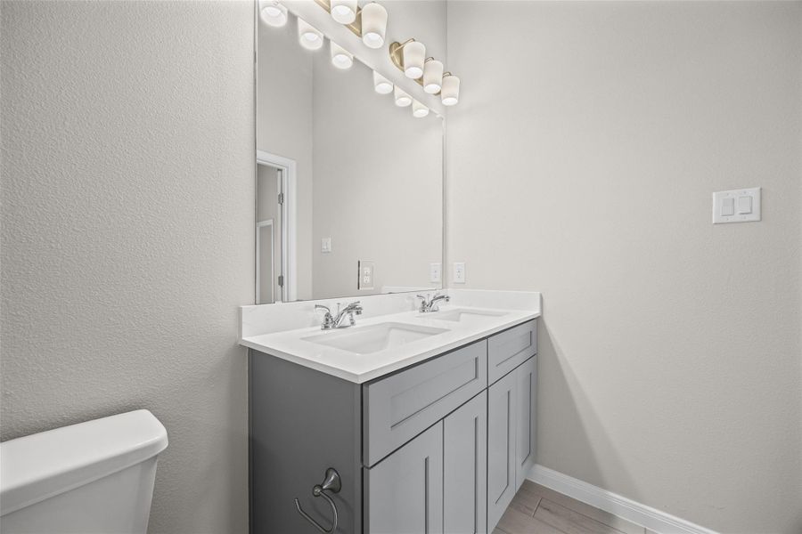 A contemporary double vanity highlights this bathroom workspace. A contemporary double vanity highlights this bathroom workspace.