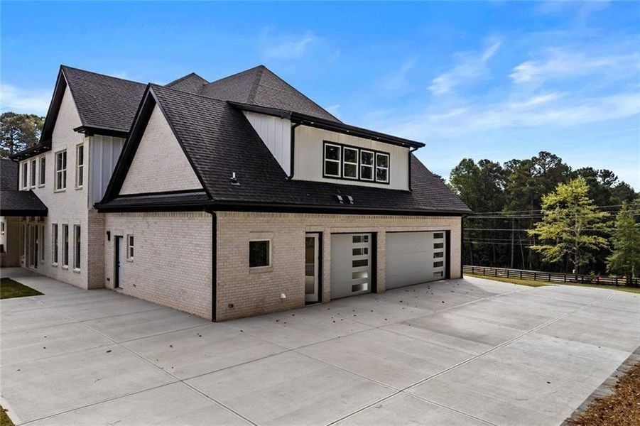 Front exterior of a new home in , Loganville, GA, highlighting curb appeal (Image 29).