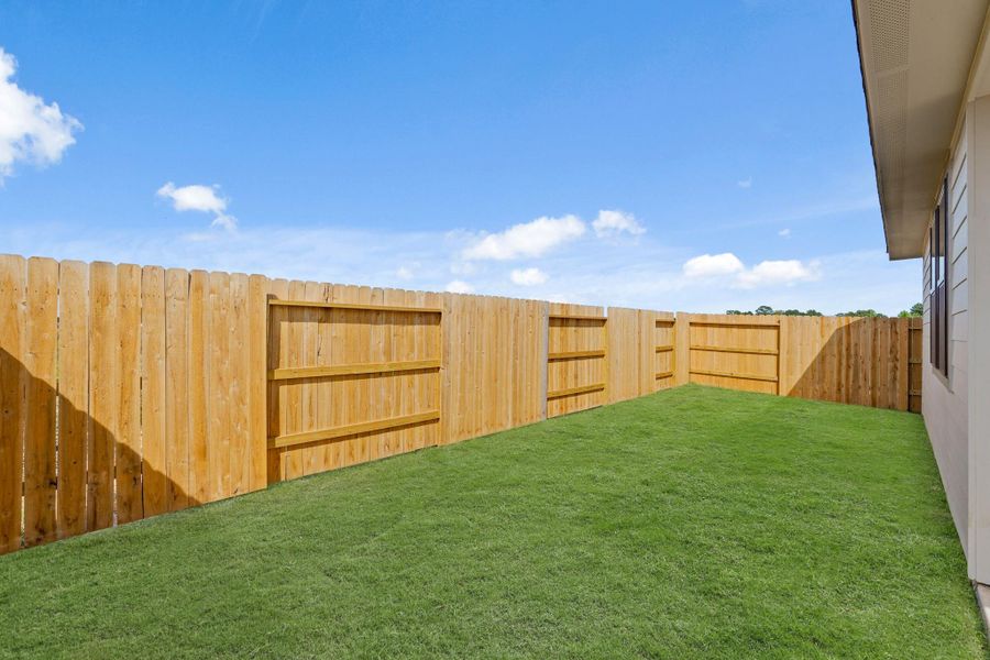 This backyard is perfect for family gatherings, social events, or simply unwinding in the fresh air. This backyard is perfect for family gatherings, social events, or simply unwinding in the fresh air.