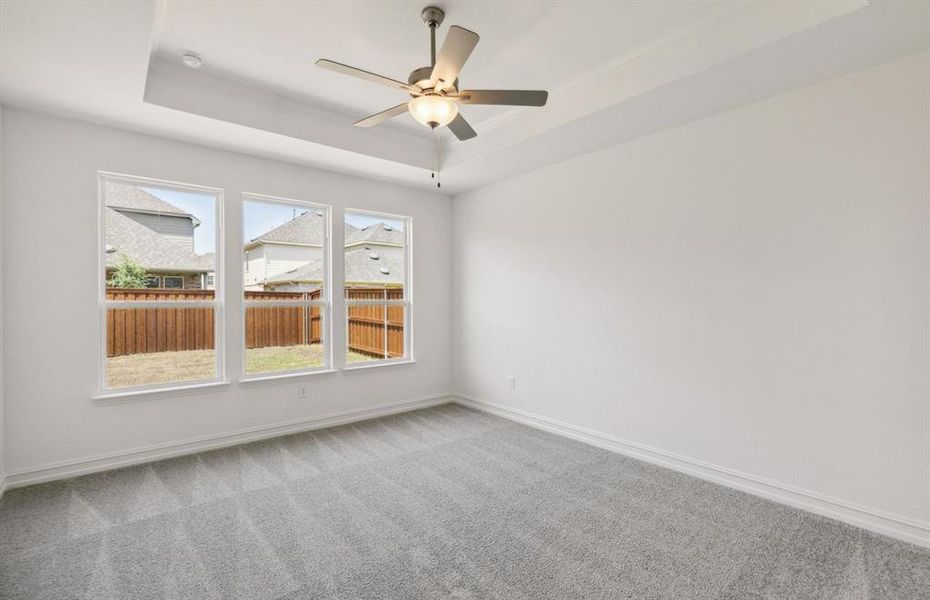 Elegant owner's suite with tray ceiling  *real home pictured