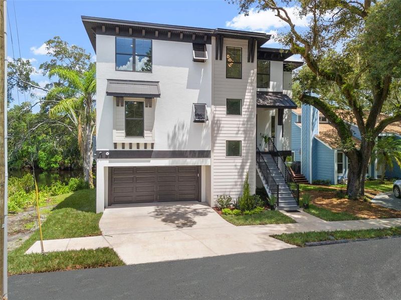 Front exterior of a new home in , Tampa, FL, highlighting curb appeal (Image 27).
