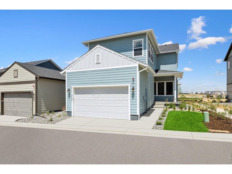 Front exterior of a new home in Kinston Cottage, Loveland, CO, highlighting curb appeal (Image 1). Front exterior of a new home in Kinston Cottage, Loveland, CO, highlighting curb appeal (Image 1).