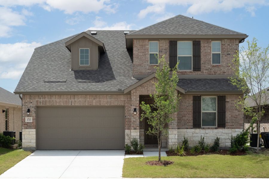 Front exterior of a new home in Verandah, Royse City, TX, highlighting curb appeal (Image 1). Front exterior of a new home in Verandah, Royse City, TX, highlighting curb appeal (Image 1).