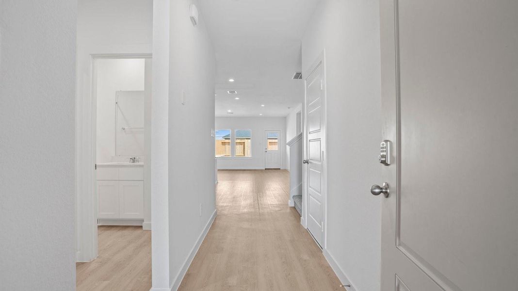 Spacious, unfurnished interior of a new home in Caldwell Crossing, Iowa Colony (Image 10).