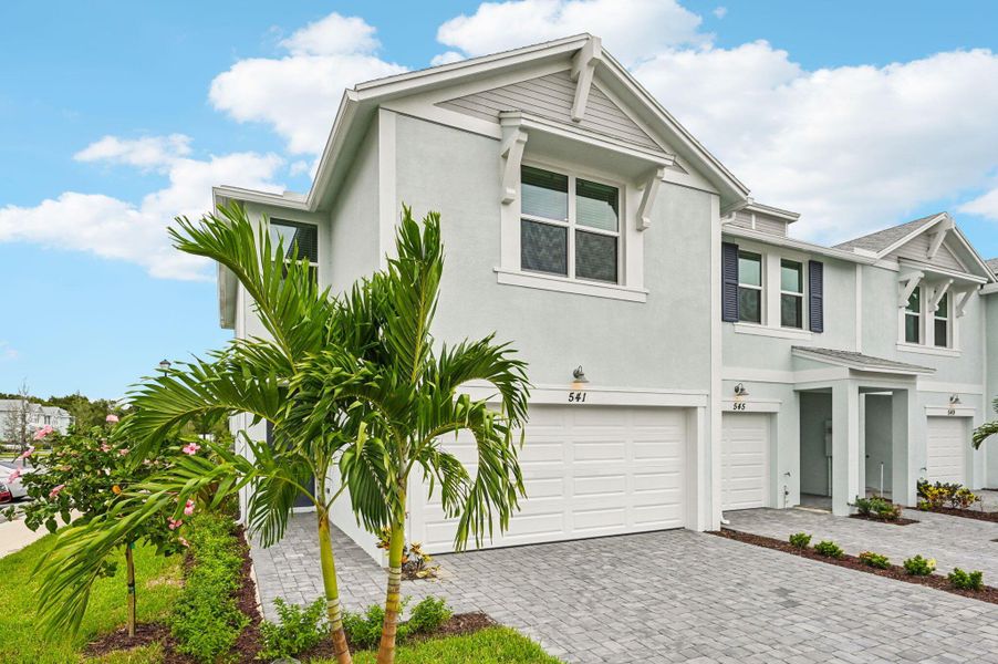 Front exterior of a new home in Tidewater, Fort Pierce, FL, highlighting curb appeal (Image 21). Front exterior of a new home in Tidewater, Fort Pierce, FL, highlighting curb appeal (Image 21).