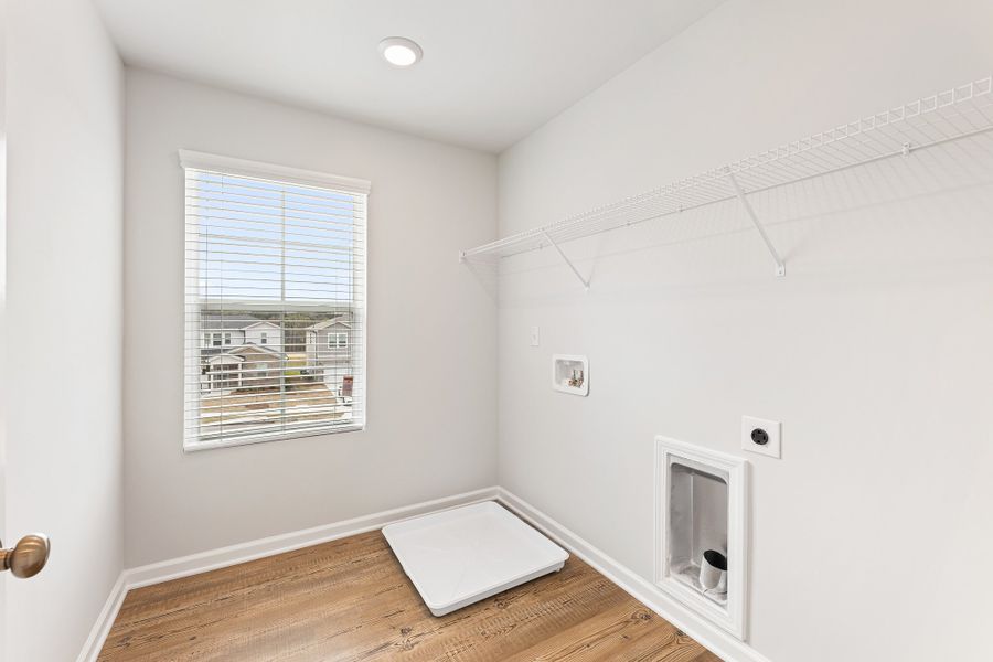 A room with a window and a rug. A room with a window and a rug.