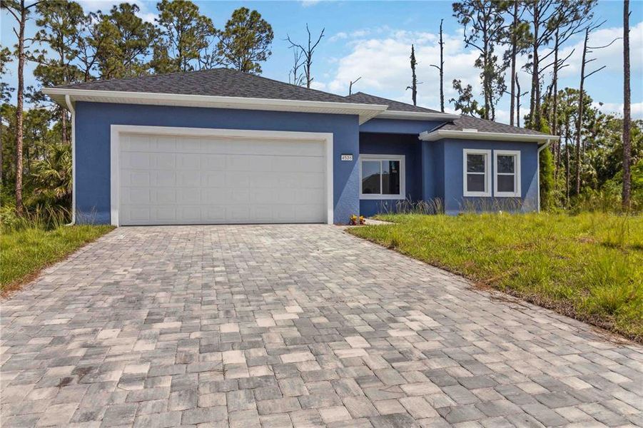 Front exterior of a new home in , North Port, FL, highlighting curb appeal (Image 2).